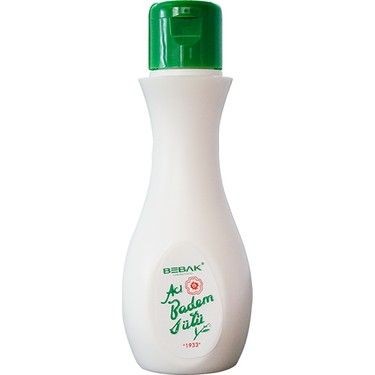 White bottle of skincare product with a green cap and green text on the label.